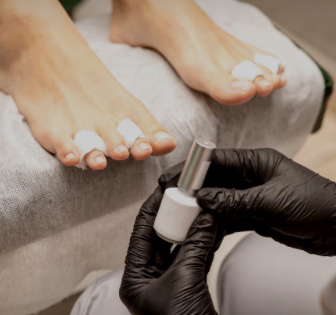 Pedicure in progress with toe separators